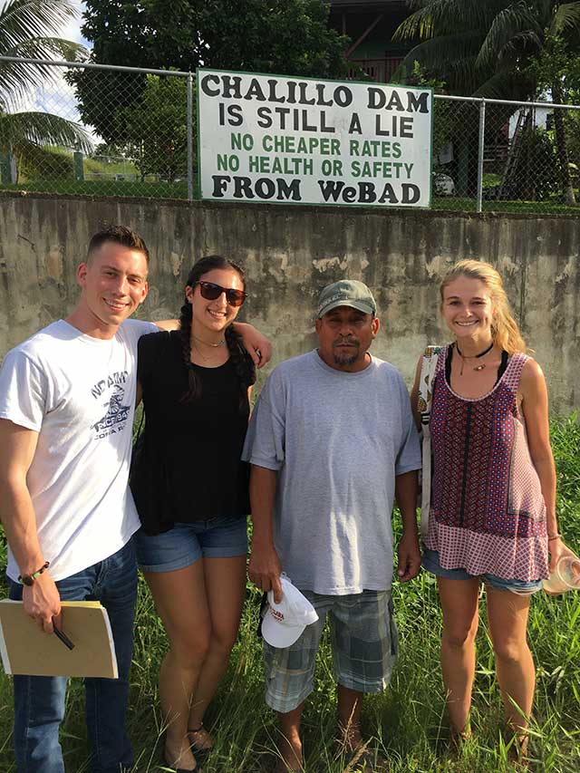 Clinic students Kyle Heitmann, Susan Shapiro, and Chloe Thomlinson with local community member.