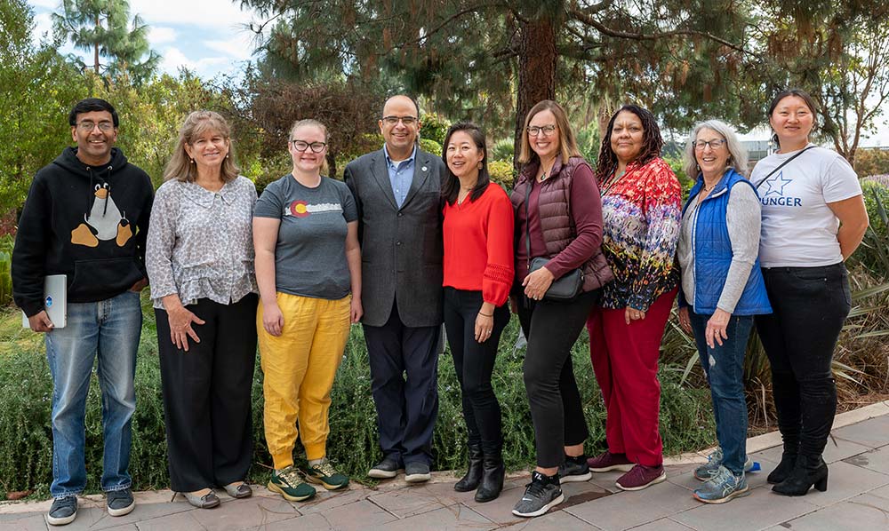 SCU faculty and students gathered for the Third Annual Second Chances Empathy Hackathon, held on October 23: From left: Sanjiv Das, the William and Janice Terry Professor of Finance at SCU Leavey School of Business; Evangeline Abriel, clinical professor and director of the Center for Social Justice and Public Service at Santa Clara Law; Santa Clara Law 3L Sydney Yazzolino; Professor Ahmed Amer, associate professor of computer science and engineering at SCU; Colleen Chien, professor at Santa Clara Law and founder of the Paper Prisons Initiative; Joy Peacock, managing director, High Tech Law Institute and Privacy Law Initiative; Margalynne Armstrong, professor at Santa Clara Law; Ellen Kreitzberg, professor at Santa Clara Law; and Sharine Xuan JD '21, founder of Elevate Community Center.