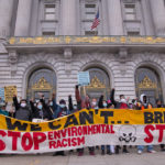 eople gathered with signs for 2021 People's Earth Day Rally at San Francisco City Hall. Credit: Leon Kunstenaar, ProBonoPhoto.org