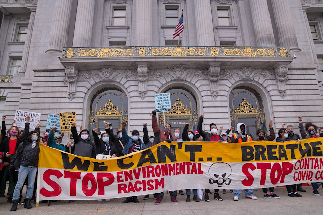 eople gathered with signs for 2021 People's Earth Day Rally at San Francisco City Hall. Credit: Leon Kunstenaar, ProBonoPhoto.org