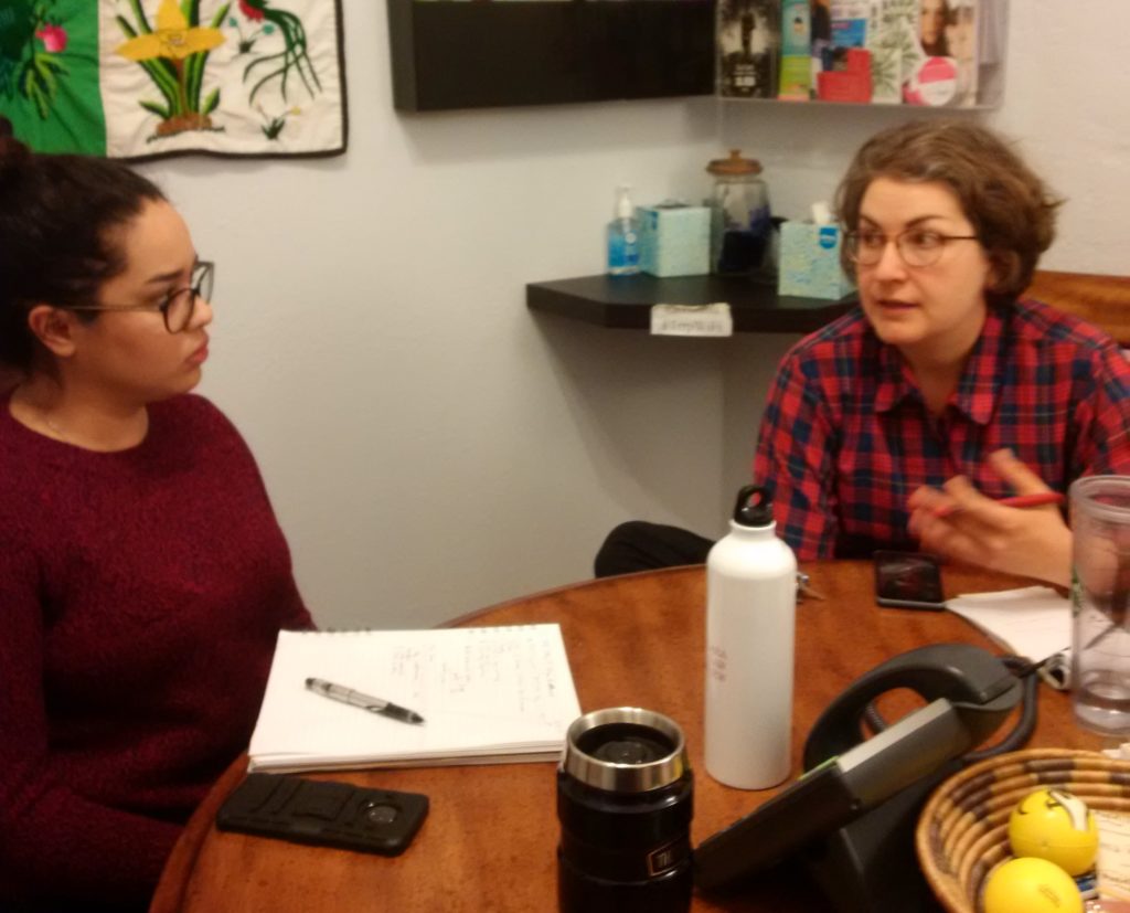 Santa Clara Law student meeting with an attorney at the Tucson office.