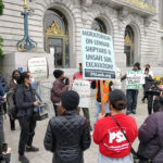 April 2021 People's Earth Day Rally at San Francisco City Hall, featuring a poster with red and black text designed by ESS major Declan Bernal '22. Credit: Declan Bernal