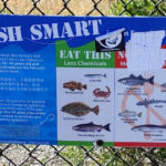 Warning sign near fishing area in Rodeo advising women and children to eat fish with "less chemicals in them." Photo: Zsea Bowmani