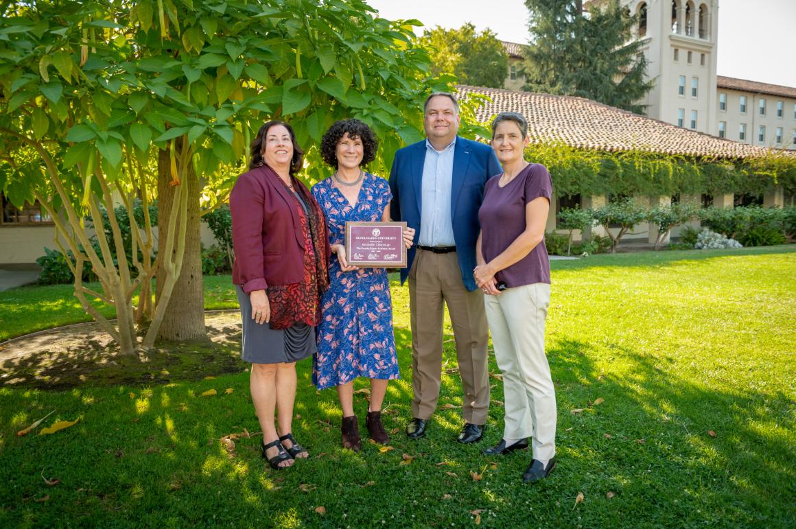 Michelle Oberman holding her faculty award